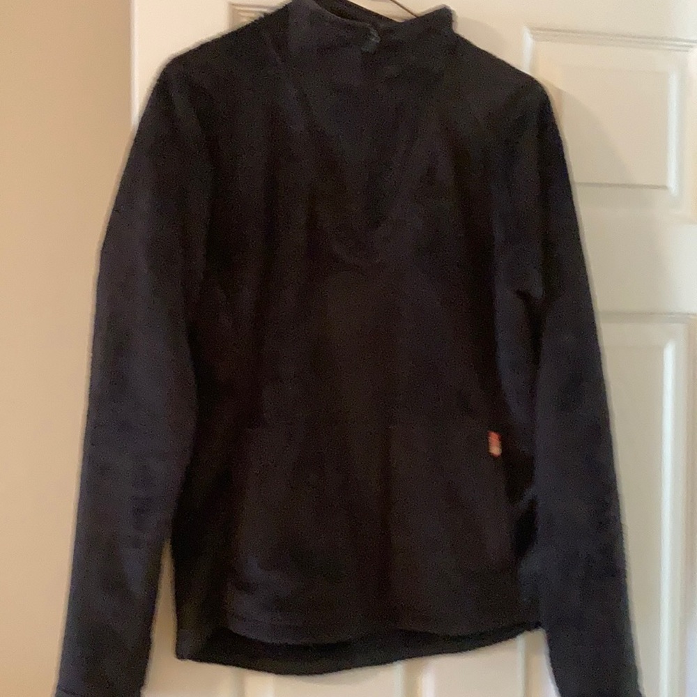 Black 1/4 zip front pouch jacket.